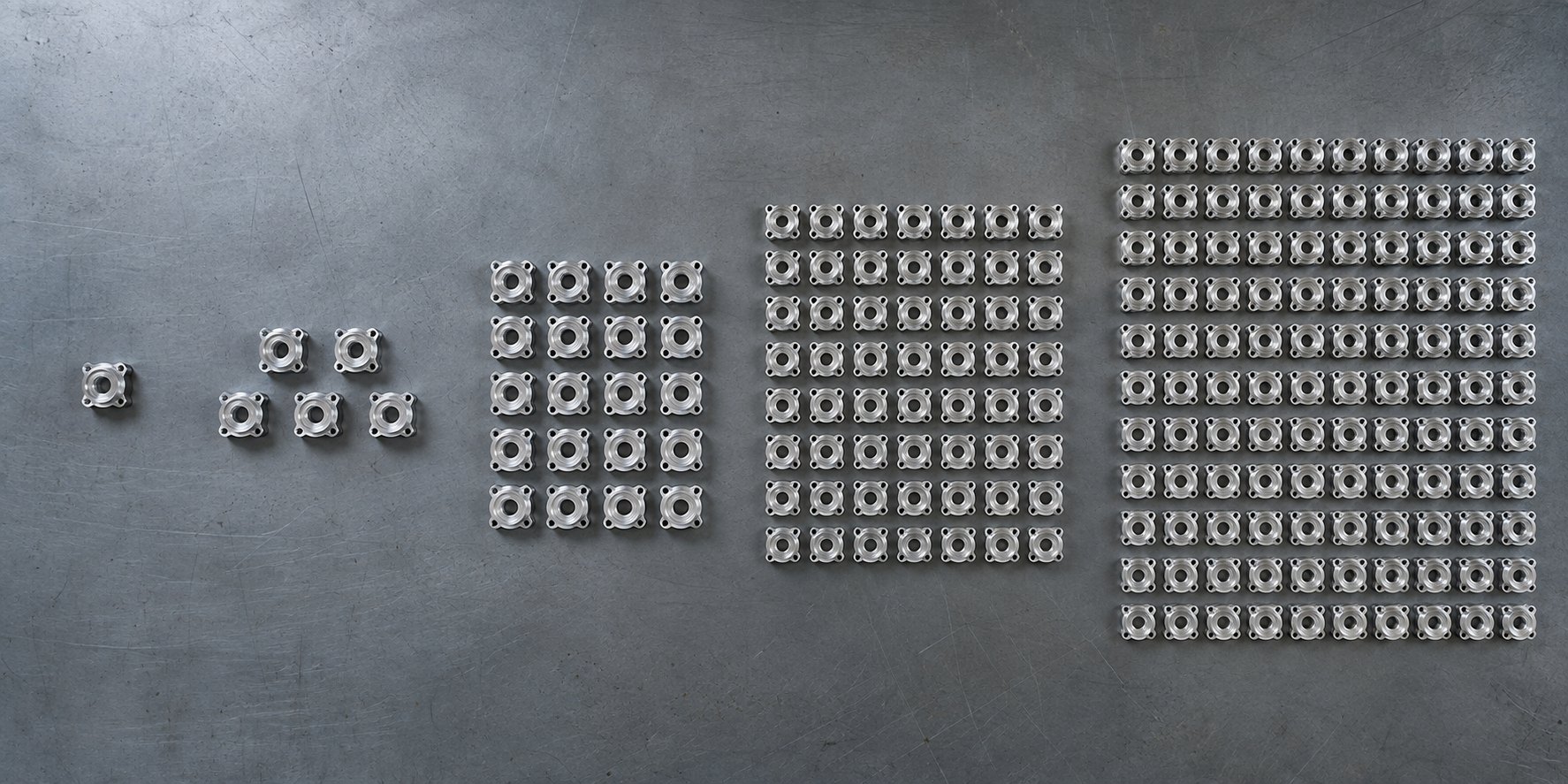 A quantity-break comparison CNC quote quantity breaks across one, five, ten, fifty, and one hundred parts